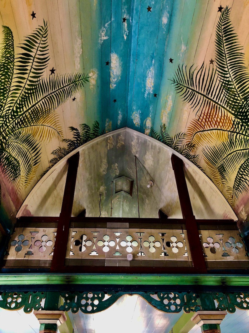 The illusion of space provided by the painted ceiling